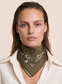 Caddie Scarf in Fairway Baroque print tied around the neck with a white button-down shirt. Olive green women's golf scarf with custom baroque golf club print. Crossover Golf, luxury womens golf apparel. Chic golf clothes for women. Women golfwear cool. 