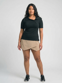 Crossover Golf New Classic Polo, tailored women’s golf polo with asymmetric placket and ultra-soft micromodal fabric, styled as a chic golf outfit for modern country club style on and off the course. luxury womens golf clothes. womens golfwear. mother of pearl shell button. 