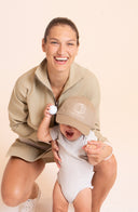 Crossover Golf Tee Time Pullover, tailored women’s golf pullover with structured fit and performance fabric, styled as a chic layered golf outfit for modern country club style on and off the course. Savanah Graham. Prince Danis Graham. Fashionable women's golf clothes on and off the course. 