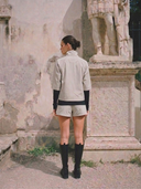 Crossover Golf Condor Cropped Windbreaker, tailored women’s golf jacket with cropped silhouette and Japanese Paper Nylon performance fabric, styled as a chic golf outfit for modern country club style on and off the course. Legion Of Honor San Francisco