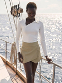 Crossover Golf Par Skort, tailored women’s golf skort with structured fit and refined silhouette, styled as a chic golf outfit for modern country club style on and off the course. Chic golf skort. Chic yacht skirt. Long sleeve polo. Chic women golf polo. Cool womens golf polo. 