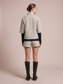 Crossover Golf Condor Cropped Windbreaker, tailored women’s golf jacket with cropped silhouette and Japanese Paper Nylon performance fabric, styled as a chic golf outfit for modern country club style on and off the course. Chic womens golf apparel. Best womens golf apparel. Cool womens golf clothes.