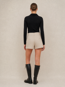 Crossover Golf Ace Asymmetric Skort, tailored women’s golf skort with asymmetric front and sculpting fit, made from Japanese Paper Nylon performance fabric, styled as a chic golf outfit for modern country club style on and off the course