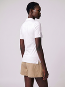 Crossover Golf New Classic Polo, tailored women’s golf polo with asymmetric placket and ultra-soft micromodal fabric, styled as a chic golf outfit for modern country club style on and off the course. luxury womens golf clothes. womens golfwear. mother of pearl shell button. 