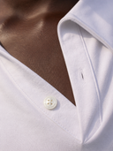 Crossover Golf New Classic Polo, tailored women’s golf polo with asymmetric placket and ultra-soft micromodal fabric, styled as a chic golf outfit for modern country club style on and off the course. luxury womens golf clothes. womens golfwear. mother of pearl shell button. 