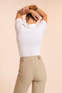 High-waisted women’s golf trousers with tailored straight-leg fit and 4-way stretch, chic golf outfit designed for on and off the course. Crossover Golf apparel 