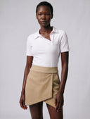 Crossover Golf Par Skort, tailored women’s golf skort with structured fit and refined silhouette, styled as a chic golf outfit for modern country club style on and off the course. Chic golf skort. Chic yacht skirt. Long sleeve polo. Chic women golf polo. Cool womens golf polo. country club style. country club womens style