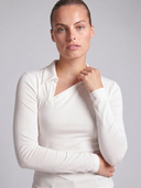 Crossover Golf long sleeve New Classic Polo, tailored women’s golf polo with asymmetric collar and ultra-soft micromodal fabric, designed as a chic golf outfit for modern country club style on and off the course. chic women's golf apparel. cool womens golf clothes. womens golf fashion. women's long sleeve polo.