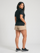 Crossover Golf New Classic Polo, tailored women’s golf polo with asymmetric placket and ultra-soft micromodal fabric, styled as a chic golf outfit for modern country club style on and off the course. luxury womens golf clothes. womens golfwear. mother of pearl shell button. Plus size womens golf