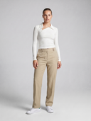High-waisted women’s golf trousers with tailored straight-leg fit and 4-way stretch, chic golf outfit designed for on and off the course.Water repellant women's golf pant. Machine washable women's golf pant. Flattering womens golf pant. Cool women's golf pant. Crossover Golf by Melanie Friedman. Golf fashion house. golf high fashion. golf chic clothes for women