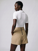 Crossover Golf Par Skort, tailored women’s golf skort with structured fit and refined silhouette, styled as a chic golf outfit for modern country club style on and off the course. Chic golf skort. Chic yacht skirt. Long sleeve polo. Chic women golf polo. Cool womens golf polo. country club style. country club womens style