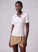 Crossover Golf New Classic Polo, tailored women’s golf polo with asymmetric placket and ultra-soft micromodal fabric, styled as a chic golf outfit for modern country club style on and off the course. luxury womens golf clothes. womens golfwear. mother of pearl shell button. 